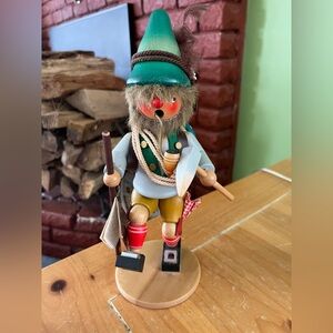 Festive Hiker Smoker with Green Hat and Red Accents